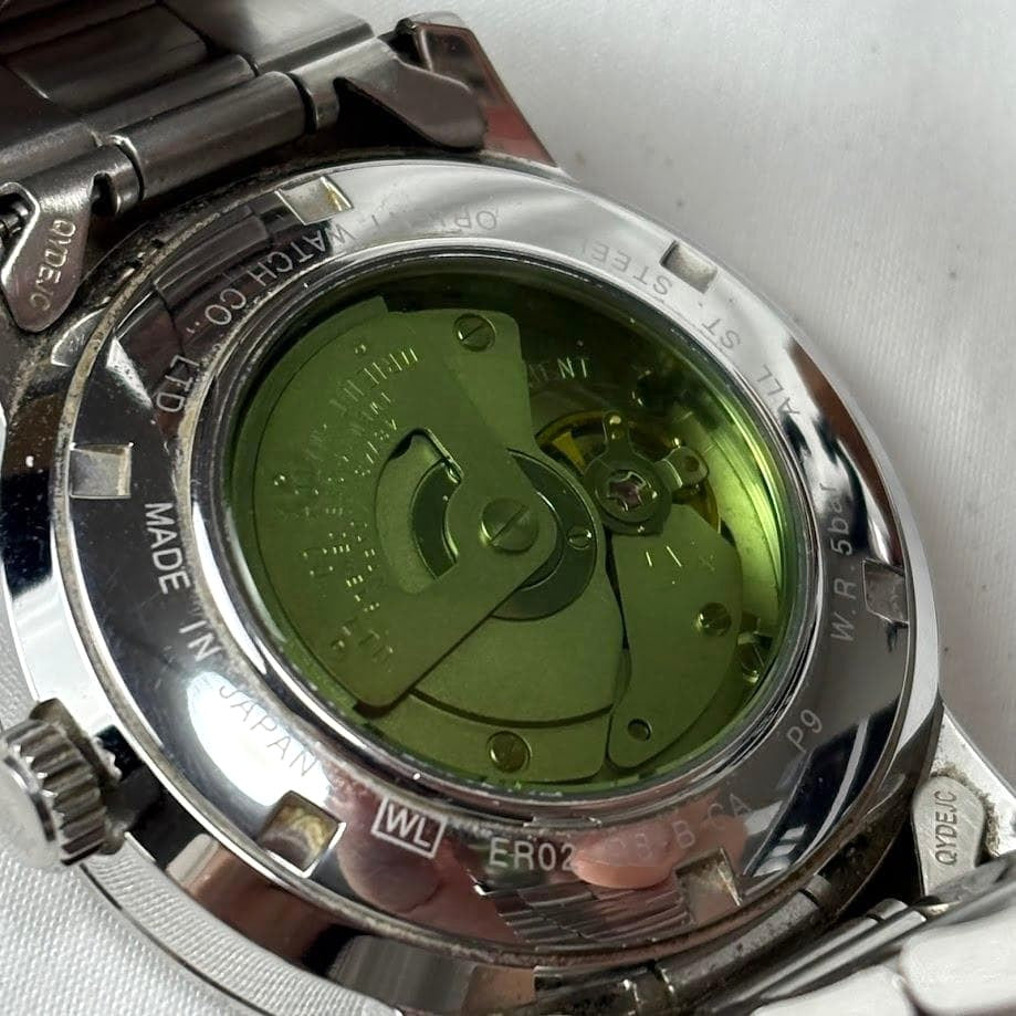 ORIENT Rainbow Disk Automatic Watch Black Dial Date Skeleton Caseback Steel