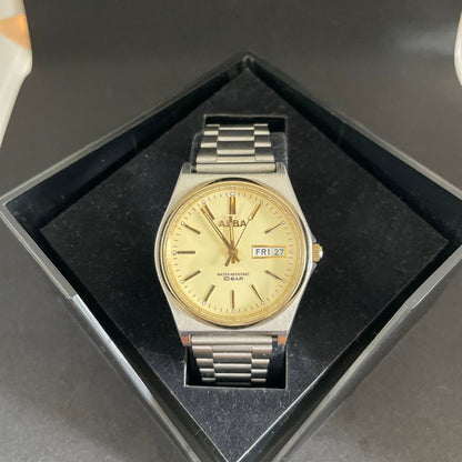 ALBA by Seiko 7N43-K001 Quartz Day Date Mens Watch Gold Dial Steel Bracelet