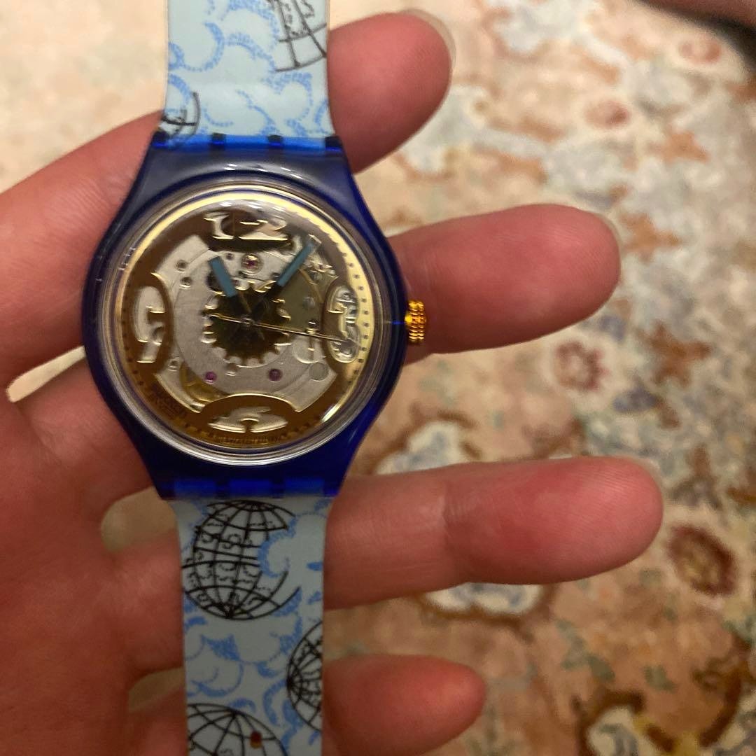 SWATCH Automatic Skeleton Watch Blue Clear Case World Map Strap Gold Dial New