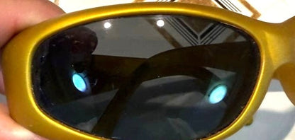 ARNETTE Vintage Gold Oval Sunglasses Matte Gold Frame Dark Lens Hawaii 1990s