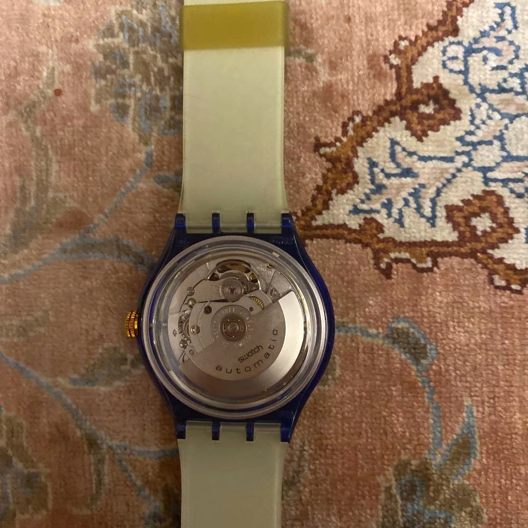 SWATCH Automatic Skeleton Watch Blue Clear Case World Map Strap Gold Dial New