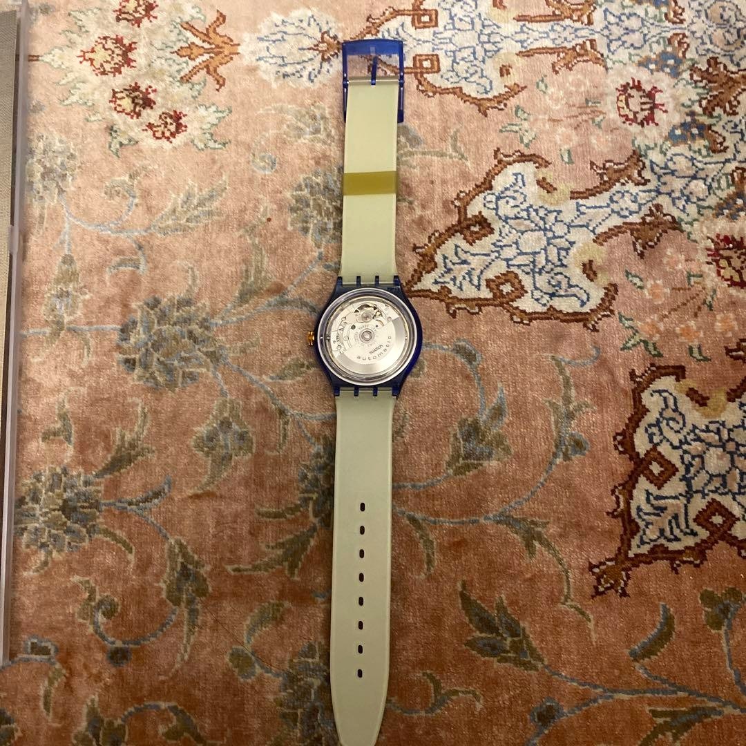 SWATCH Automatic Skeleton Watch Blue Clear Case World Map Strap Gold Dial New