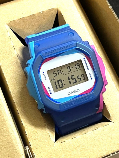 Casio G-Shock DWE-5600PR-2JR Overprint Square Watch Blue Pink Resin New Unused