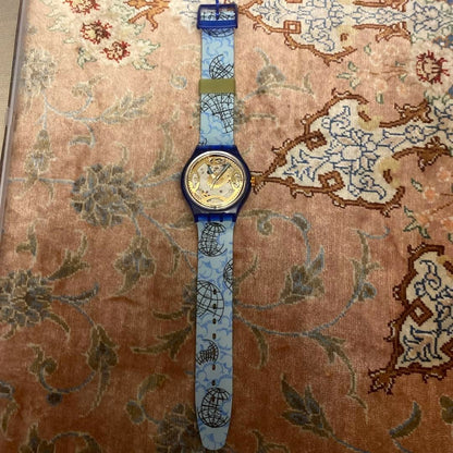 SWATCH Automatic Skeleton Watch Blue Clear Case World Map Strap Gold Dial New