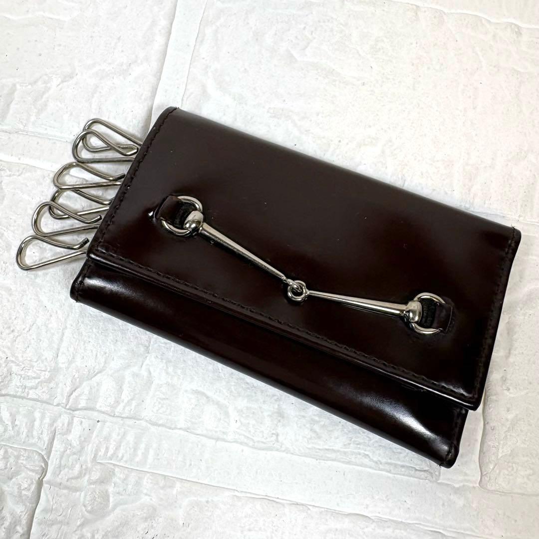 GUCCI Brown Enamel Leather Horse Bit 6 Rings Key Case Key Holder Used